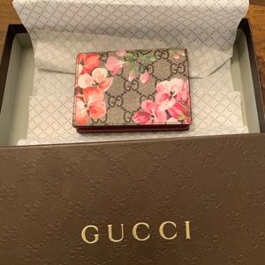 An authentic Gucci card case wallet .